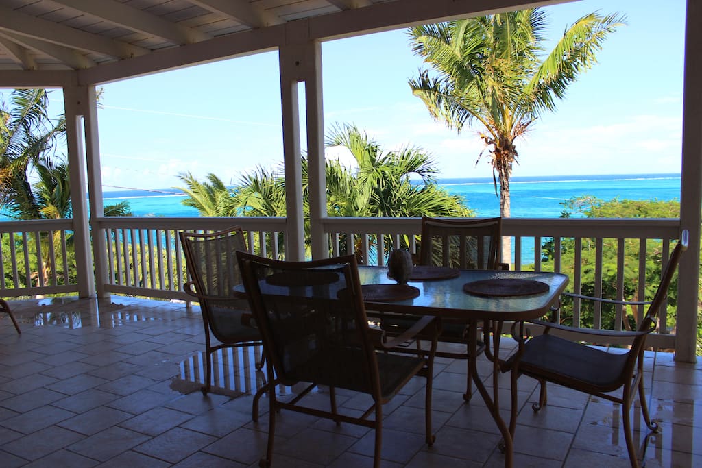 Views from the expansive deck with outdoor dining and 2 lounge chairs