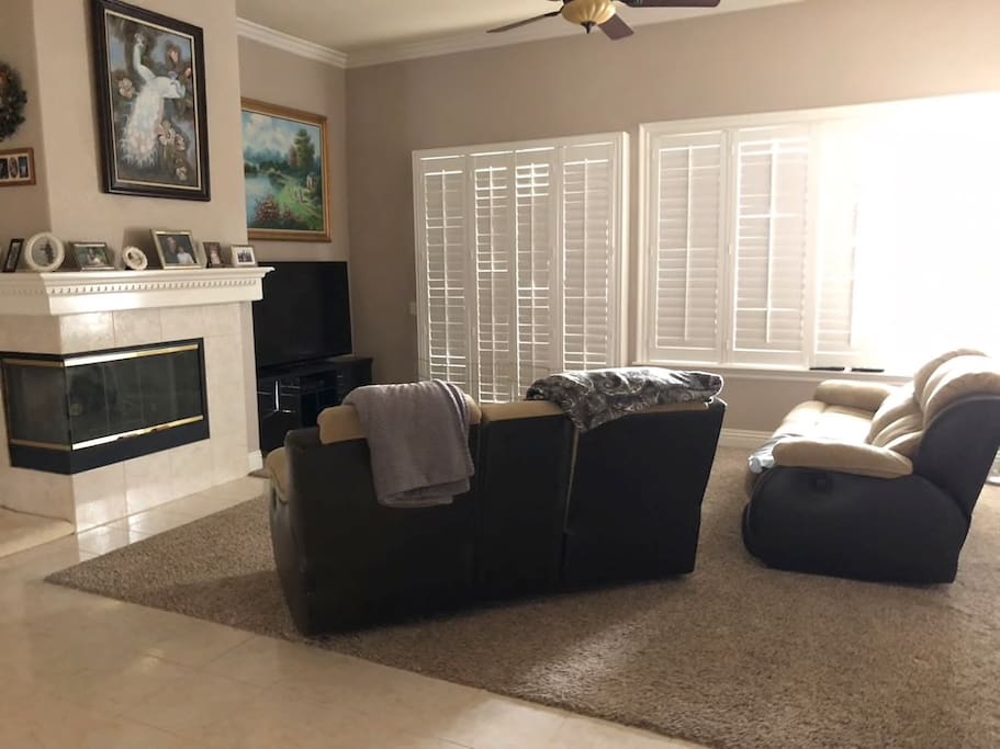Family room with TV and fireplace