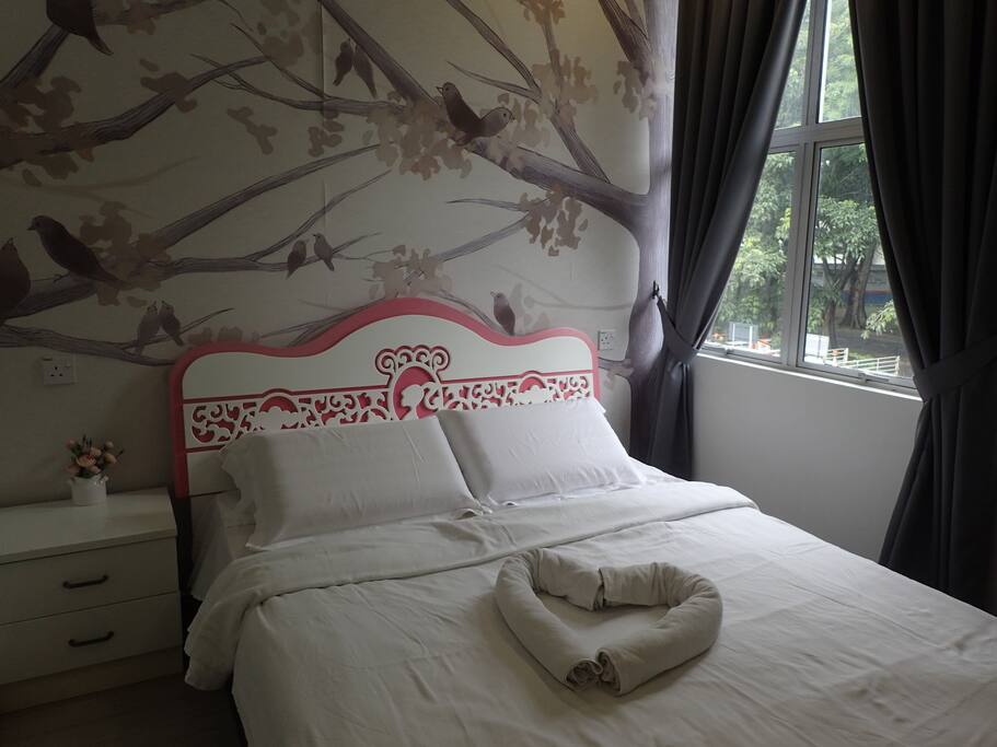 cozy queen size bedroom with side table