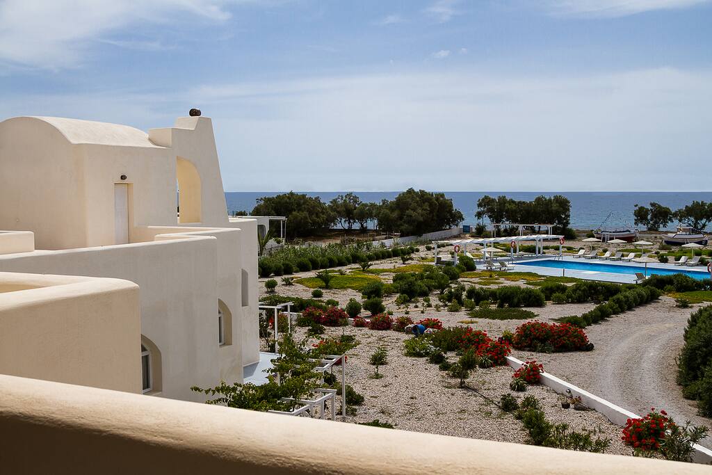 View from balcony towards pool and sea