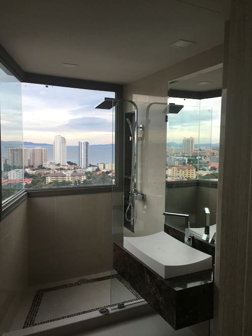 The bathroom shower with views out to the ocean and islands shower with a view