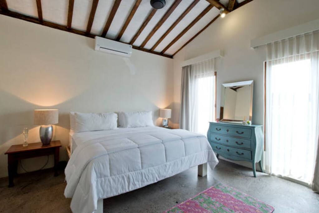 Massive bed and bedroom.