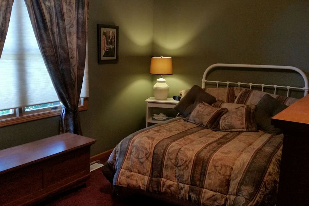 Double bed with large window for light. Pull down shades for privacy.