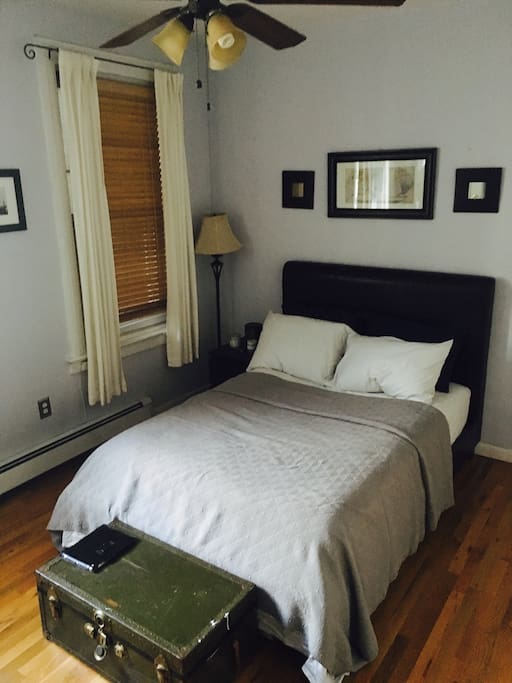 Bed room with full size bed and window mounted AC
