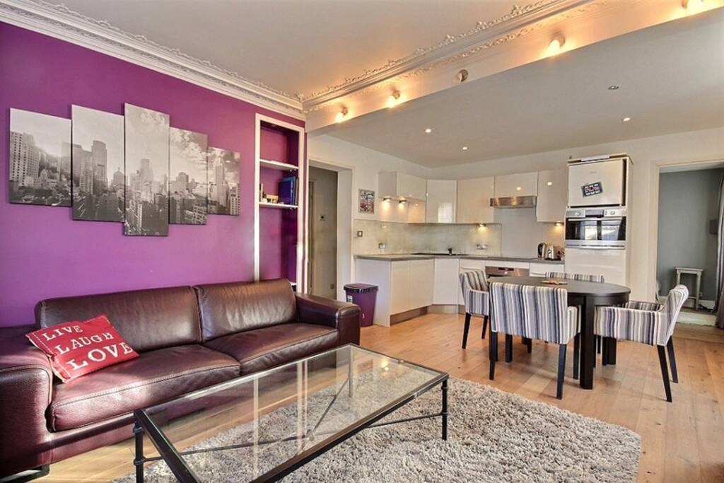 Living
The 25 square meters living room has 3 windows facing street and facing courtyard . It is equipped with : dining table for 4 people, 2 sofa, coffee table, TV, DVD, stereo, built-in shelves, chest of drawers, hard wood floor.