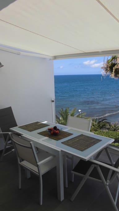 Dinner table at the terrace by the sea