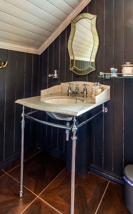 This beautiful marble topped Victorian sink is fitted with a Victorian antique mirror