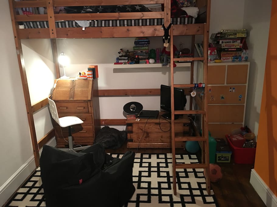 Cabin full size single bed with desk space, area to play games, overlooks back garden