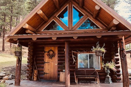 Log cabin nestled in the mountainsides