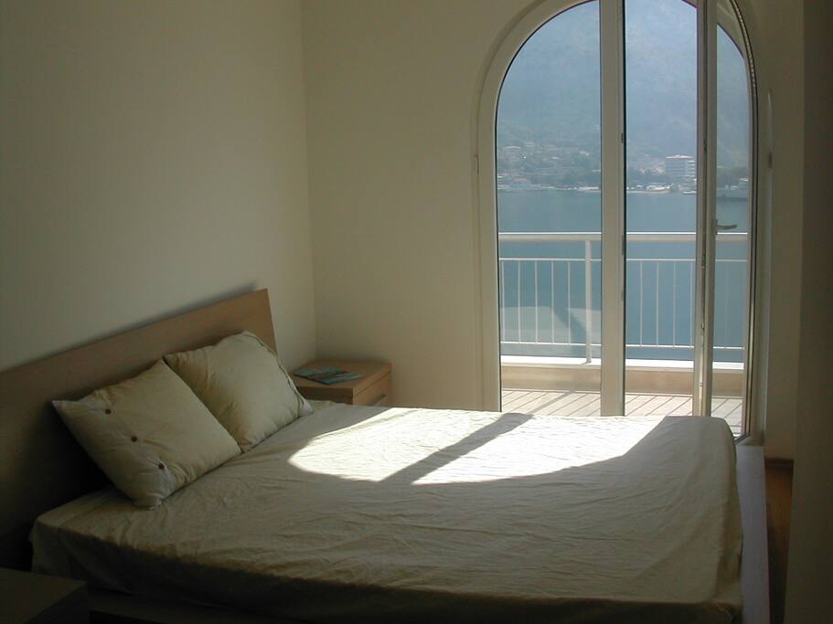 Master bedroom with sea view and balcony access