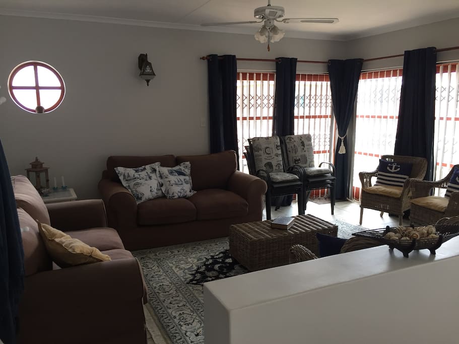Lounge, with access to the balcony and outside braai
