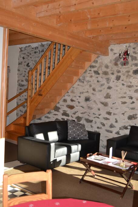 Stairs leading from the living area to the two bedrooms upstairs