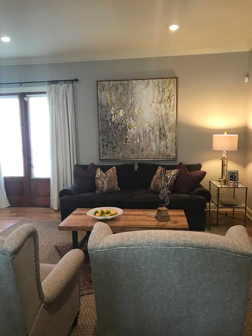 Living room and french door access to screened in porch.