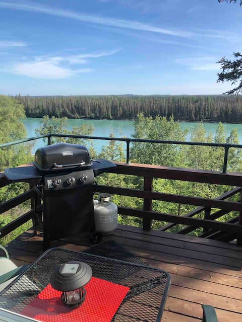 Successful Airbnb property: Kenai Riverfront Cottage. Fish from our bank. Deck in Soldotna