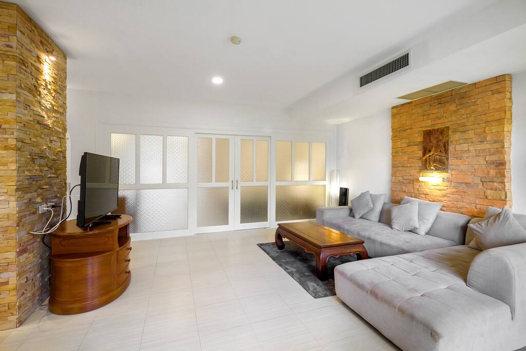 Spacious living room with a double door onto the balcony