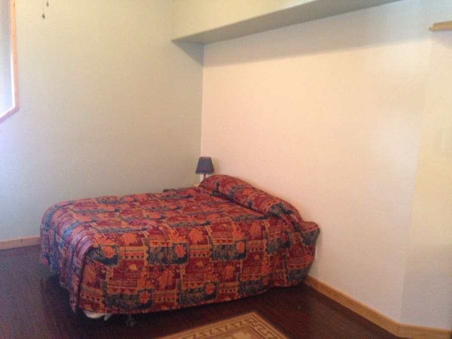Queen bed in common room