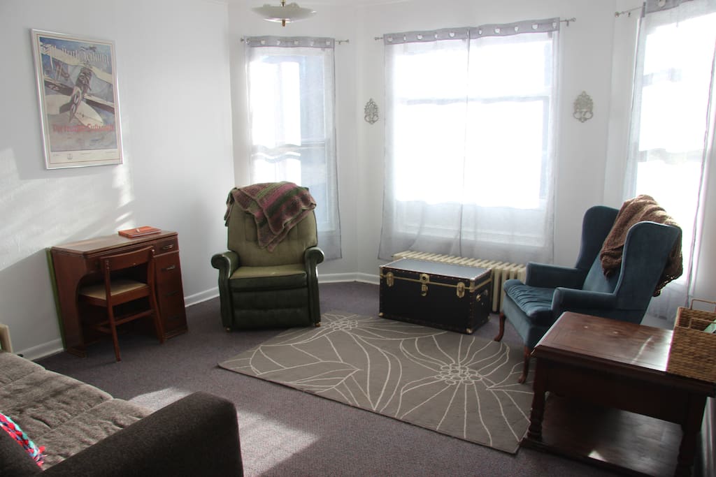 Cozy and sunny living room, perfect space to read, play games, nap, or just hang out!