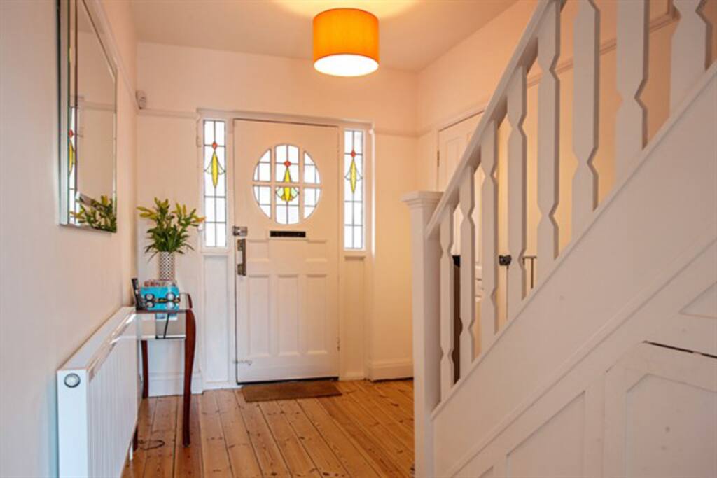 Off the hallway is large utility room with plenty of storage for bikes or prams, a washing machine and dryer and toilet and shower room