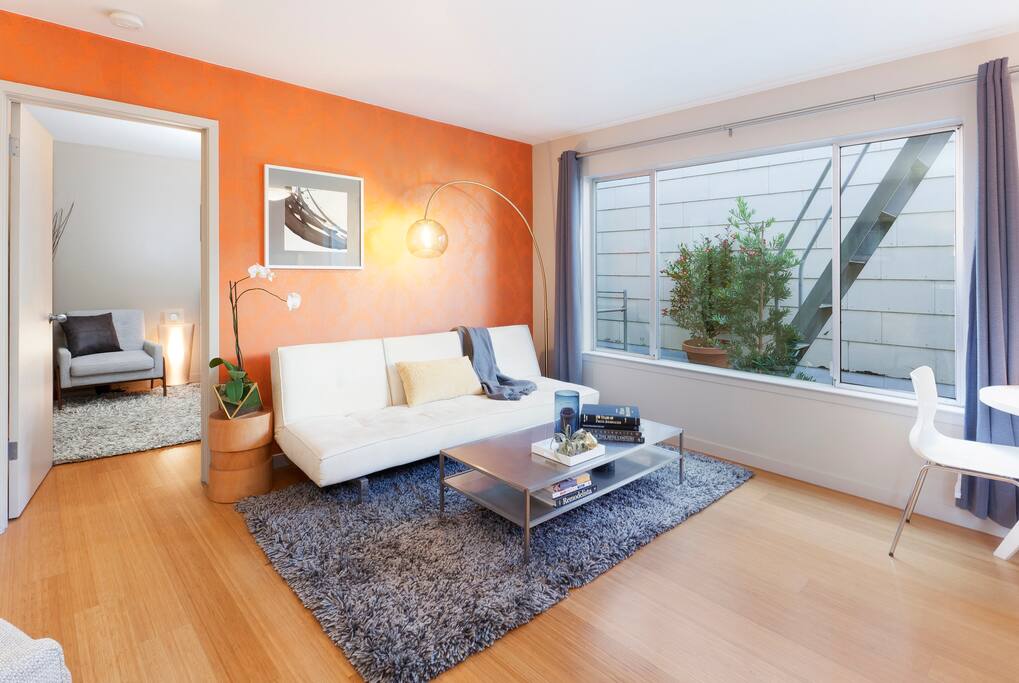 Living room area and entry into bedroom