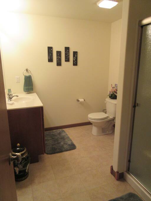 Private bath with walk in shower. Shower seat available upon request