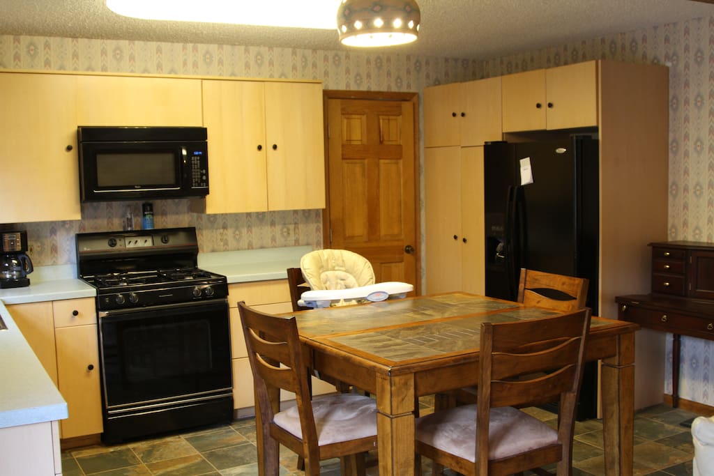 Kitchen with microwave, range, and dishwasher