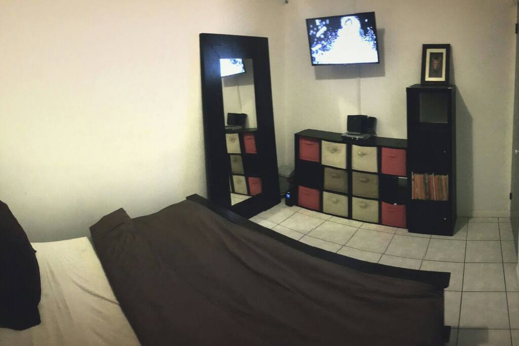 Master bedroom with cable and smart TV.