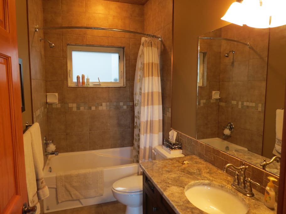 Private Bathroom with Shower, Tub, Toilet and Sink