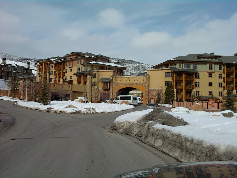 Sundial Lodge from front access road. Our C building is the one to the right of the arch, we are on 3rd of 4 floors. This white Canyons bus under the arch can take you to the town of Park City if you do not have a car