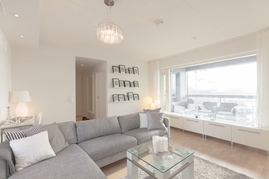 There are huge windows in the apartment bringing in lots of light and providing a panoramic view towards sea and nearby islands.