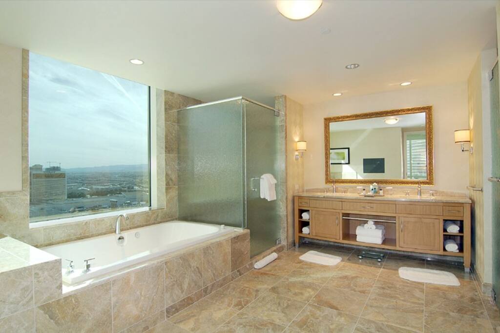 Amazing Strip views from luxury jetted Jacuzzi. Beautiful large marble master bathroom.