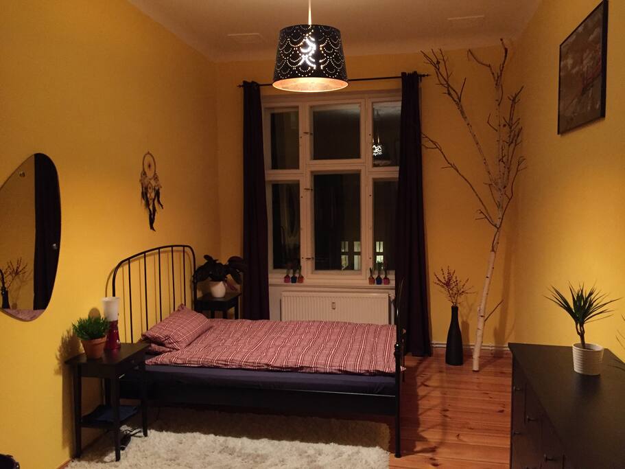 The bedroom with a large bed for 2 people and hangers for your clothes...