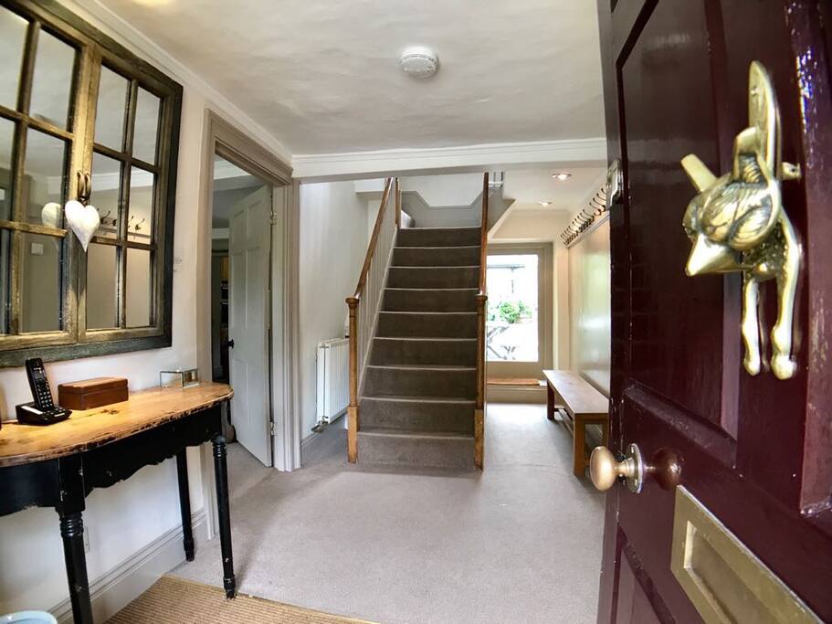 Entrance hall with plenty of coat hooks, wc under the stairs.