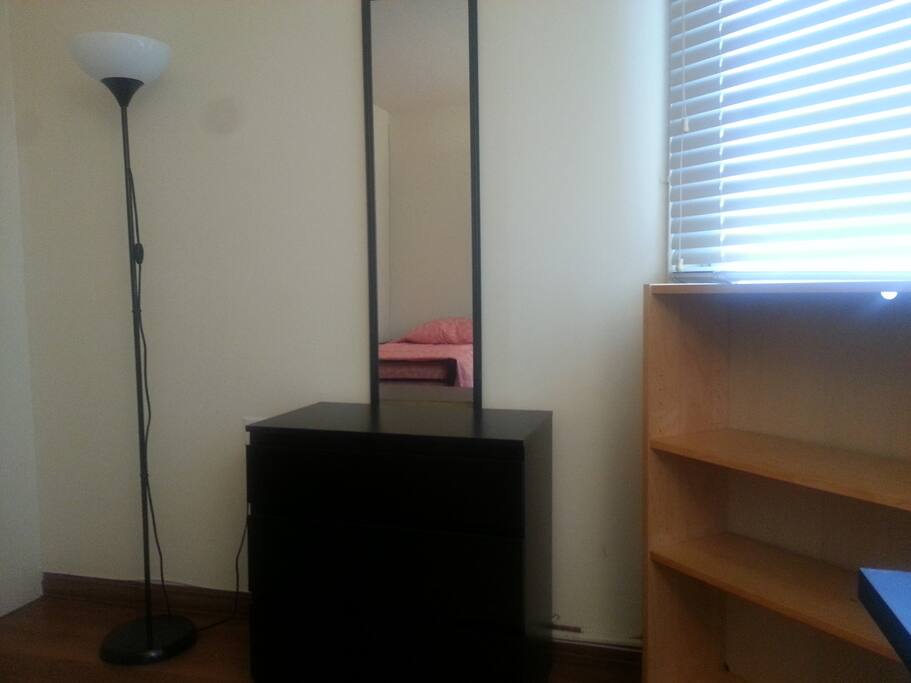 Full-length mirror and dresser are yours to use.