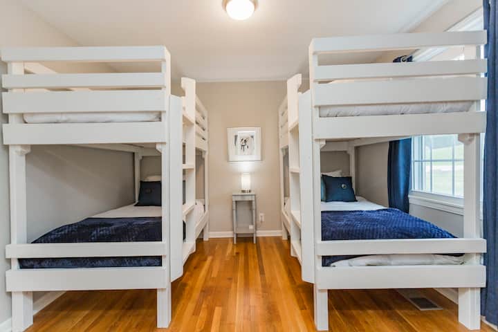 Bunk room with  beds with plenty of space between top and bottom.