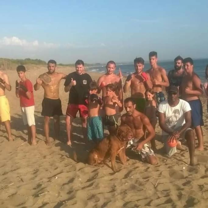 boxing club team in the beach area. They sleep in tent bungalows at Jae Academy under