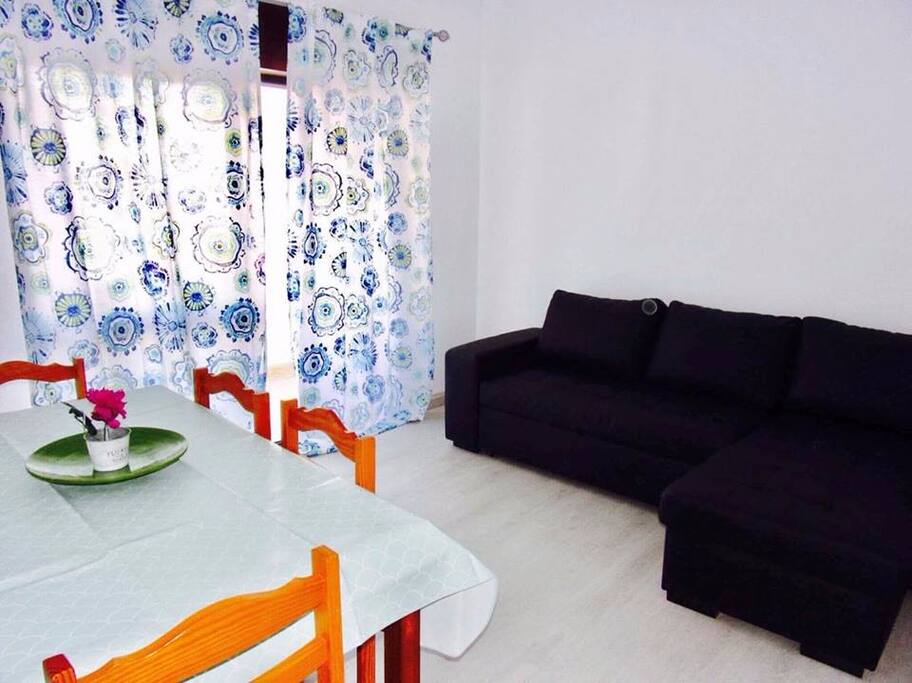 Living Room with Flat TV Screen and Sopha-Bed
