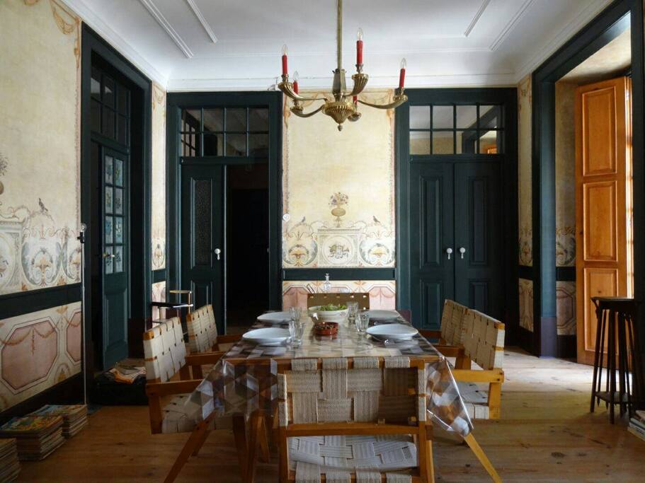 Restored 18th century mural paintings, Belgian 1930s De Coen furniture and original lighting in our living room