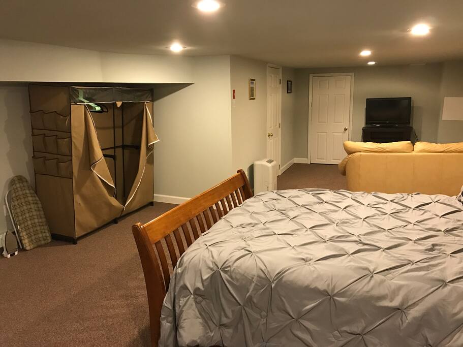 Portable closet with ironing board