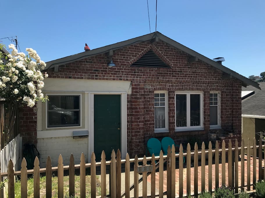 Another view of the front, showing our double glider and bath tub garden - great for chatting with neighbors or catching the last bits of sun in the late afternoon.