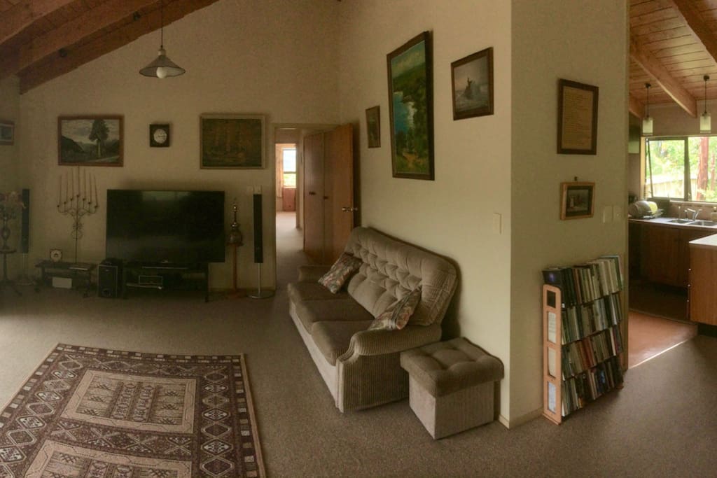 Open living space. Warm and friendly with fireplace (out of shot). Welcome to come and watch movies and sport!