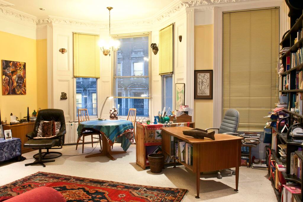 Living-room: large windows and ample lighting.