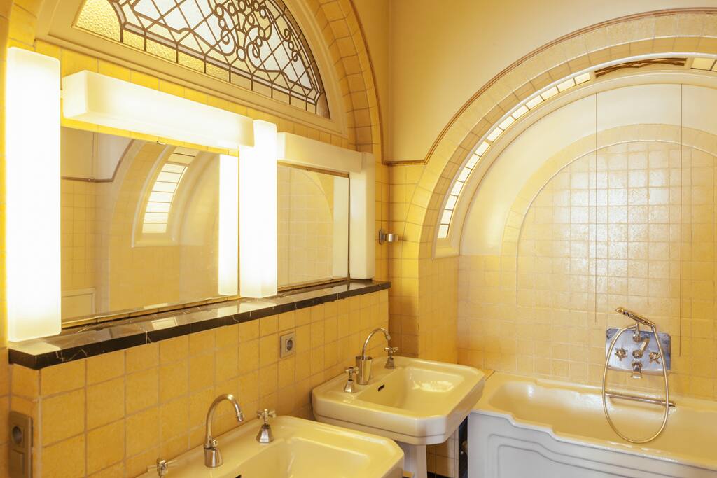 Your ensuite bathroom with walk in shower, two sinks, toilet, bath, shower gel, shampoo and towels