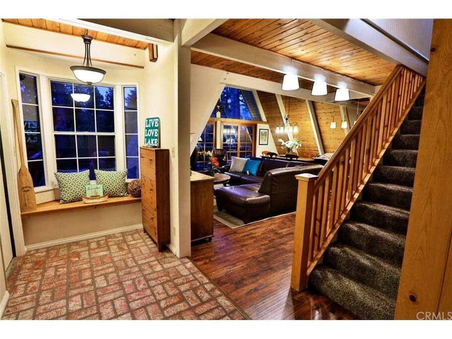 ENTRYWAY- You will feel the warmth and undeniable charm of this beautiful home the minute you walk through the door! There is top-quality wood ceilings and wood floors throughout!