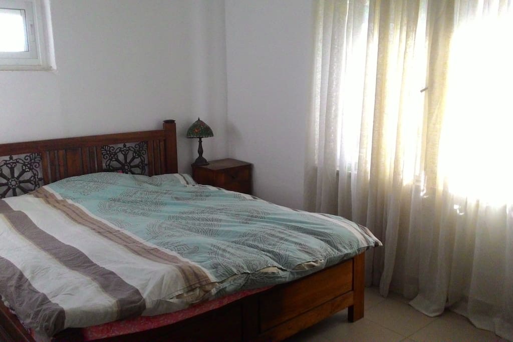 King size bed with orthopedic mattress