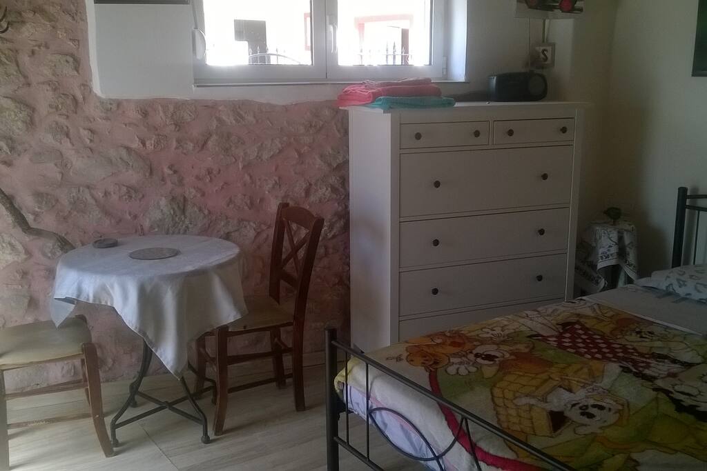 Table, chairs and cupboard