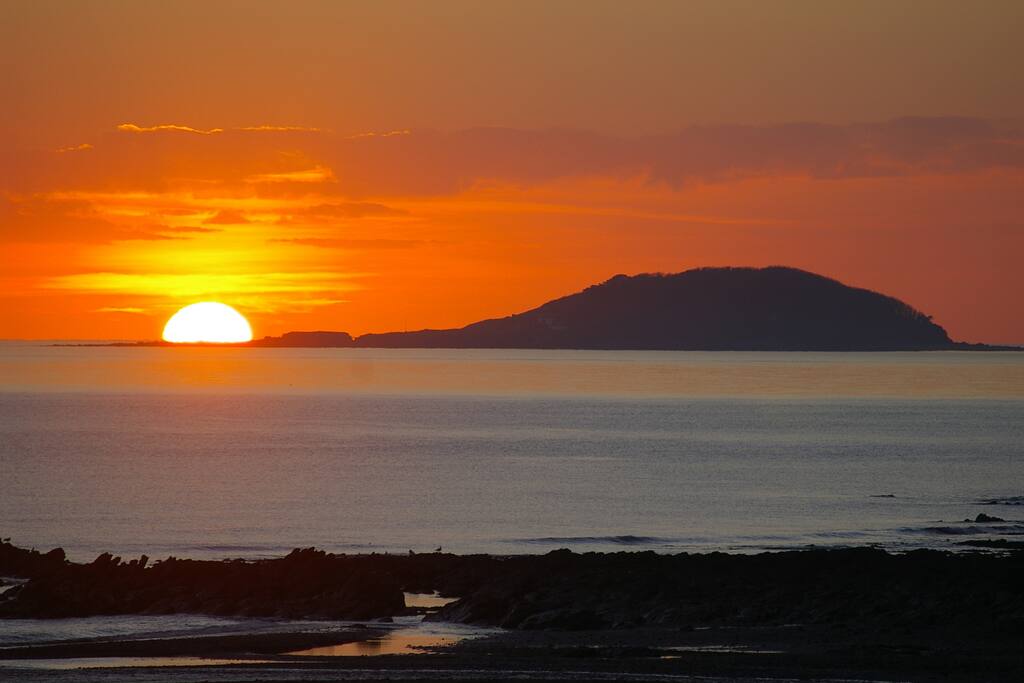 Sun setting over St Georges Island; taken from the balcony at 'Driftwood'