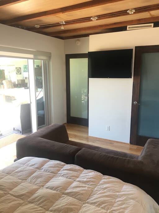View of the 4K Roku TV from the bed and couch