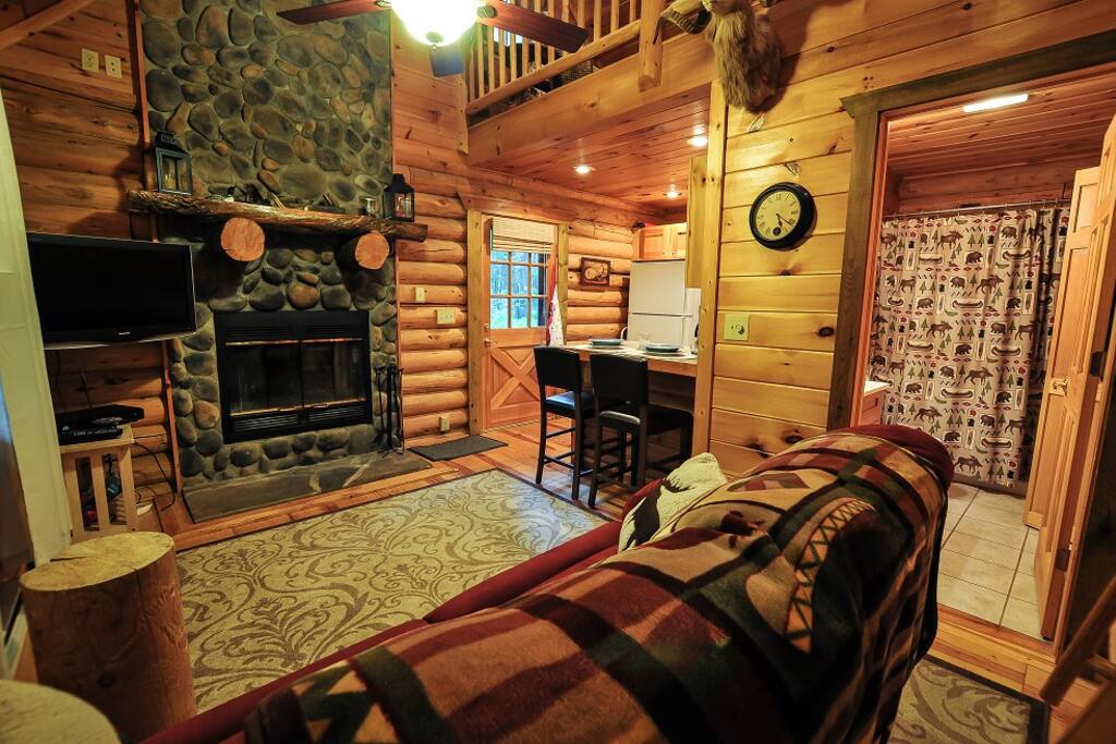 Living room with a wood fireplace