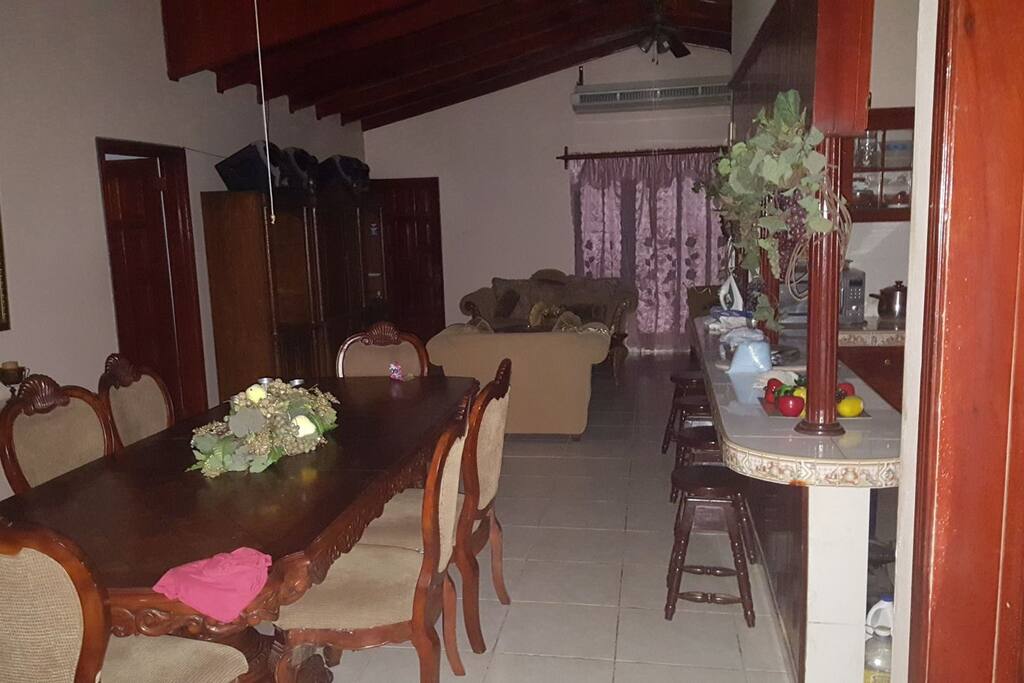Dining table and living room on the background.