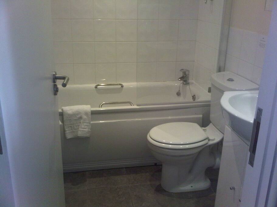 Bathroom with tub and shower
